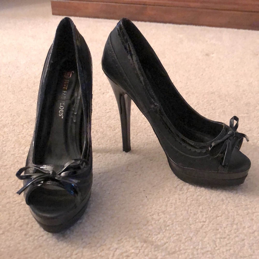Black peep-toe bowed platform heels